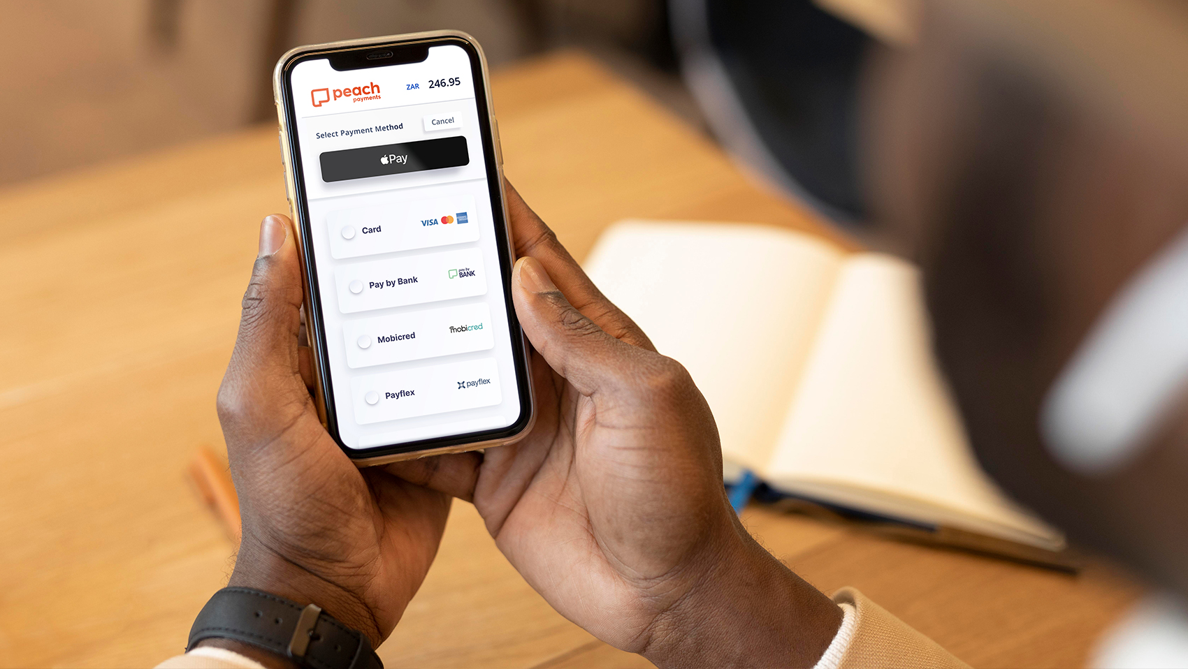 Peach Payments Checkout - Mobile In Hand Wide Image